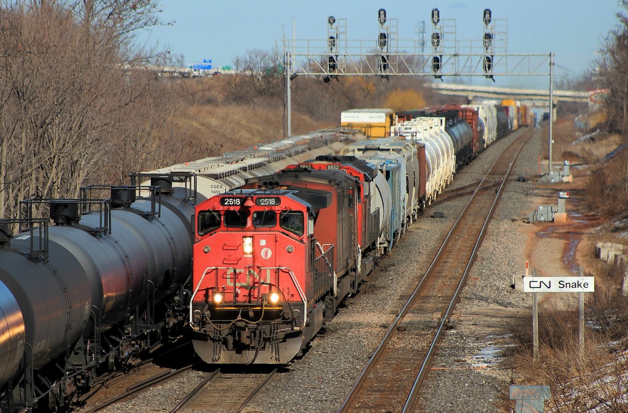 X421 is meeting 394 in the shot. Love those Canadian cab Dash 9s.