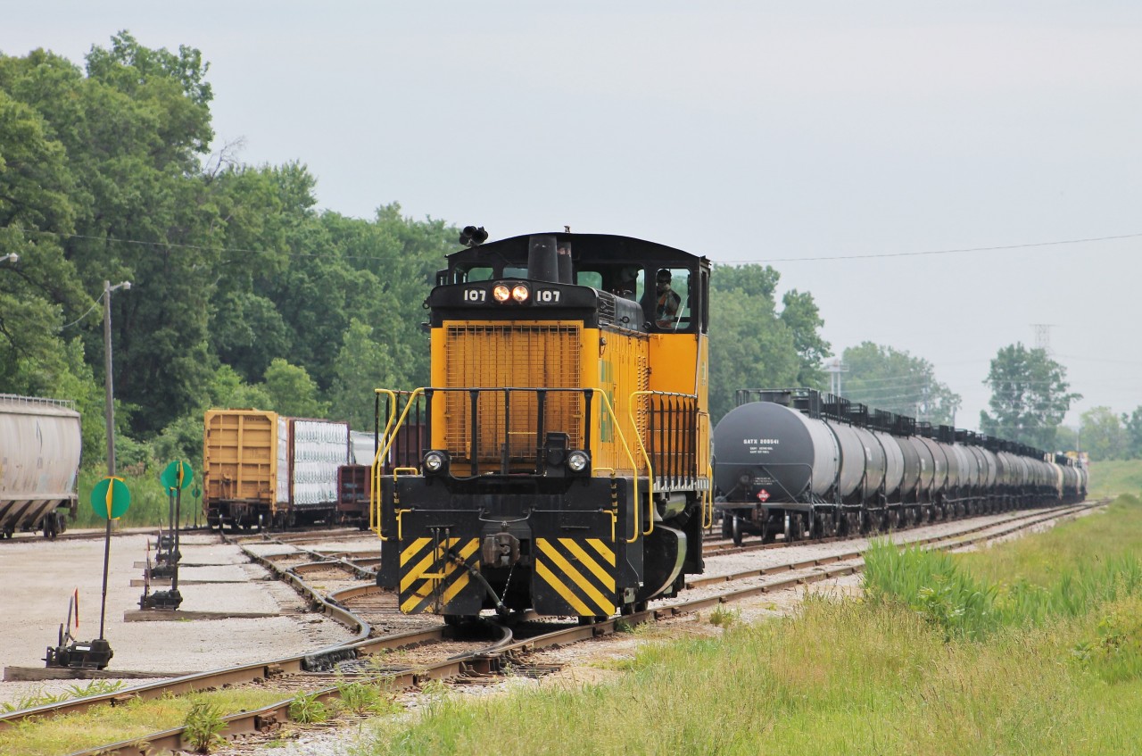 An ETR crew has just finished doing their work in Ojibway Yard on Windsor's west end and are preparing to grab a cut of cars to interchange with CP and CN before calling it a day. The conductor on duty was having fun watching us "foamers" taking photos while they started to head down to the other end of the yard.