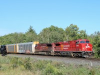 Former CP 9626, all cleaned up and reconditioned and renumbered to CP 8144 leads CP 9705 past the Flanders sign and up to the Campbellville Road crossing on its way westward up the Galt sub cleared to Ayr.