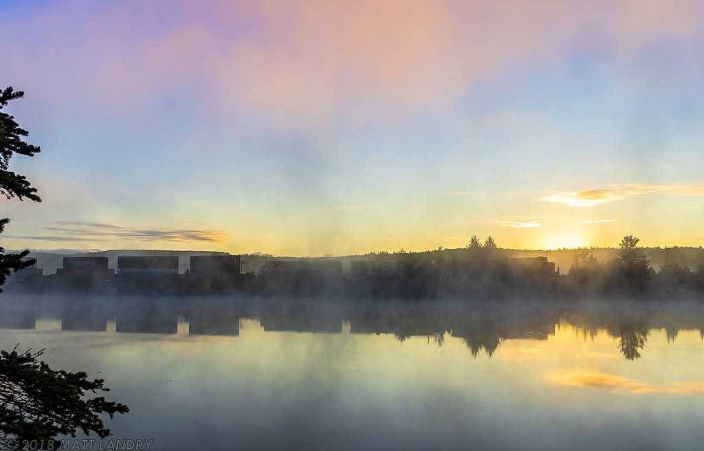 CN 2809 leads train Q120, as they head along the misty Folly Lake, Nova Scotia, with the sun making it's way over Folly Mountain.