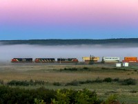 CN 2958 leads stacker train Q120, approaching Dorchester, New Brunswick, at sunrise. 