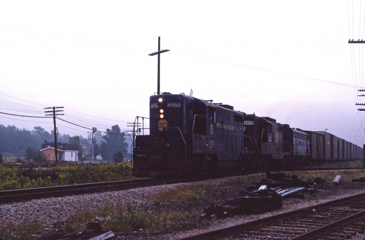 In the mid 1970s, N&W was operating two trains in each direction across the Cayuga sub. Westbounds ran as extras, one typically leaving Fort Erie early in the morning. Today we have N&W's only Canadian-built GP7 (the 3453), GP9 2479, and an unidentified F7A leading the train.