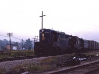 In the mid 1970s, N&W was operating two trains in each direction across the Cayuga sub. Westbounds ran as extras, one typically leaving Fort Erie early in the morning. Today we have N&W's only Canadian-built GP7 (the 3453), GP9 2479, and an unidentified F7A leading the train.