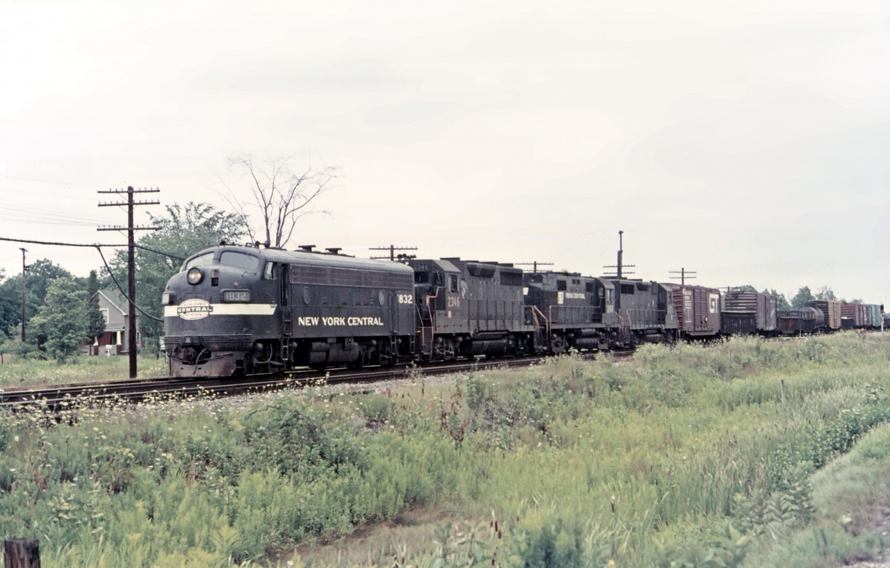 Here is an interesting early merger consist heading west through Canfield in September 1968: NYC F7A 1832, PRR GP35 2346, a former PRR RS27 now in PC paint, and another PRR GP35.