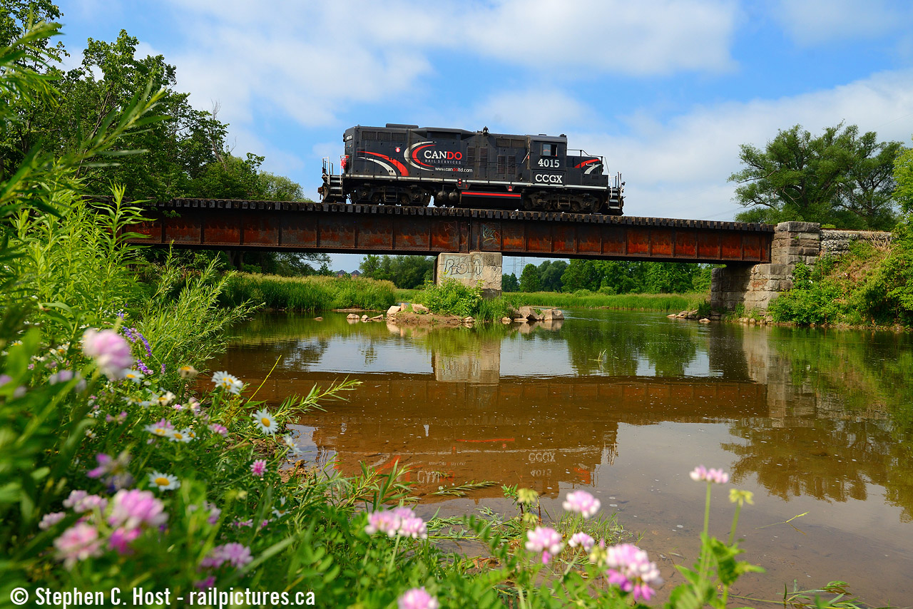 Last train: I was away the week before and knew I had no chance in hell at getting the last OBRY run on the Friday. But when I got home I learned the train was delayed a day... and of course I booked it Saturday to Streetsville to get a couple photos of the last train. I had had an interest in this bridge for some time but never scoped it out - and thankfully I had the time to compose something that turned out rather nice - luck was also on my side as the sun came out at the last minute just as Steve Bradley and Steve Thomas, crew for the train, crossed over the Credit River and into my frame.
I would also learn that the former Toronto Suburban Railway (to Guelph, abandoned 1930's) right of way and diamond with the CPR (CVR) Branches was just behind me. The TSR ROW basically was within feet of the river on other side of the railway bridge on the left (west) side. There isn't much evidence left of the TSR But some does exist at this spot, it's one of the few undeveloped portions of land in the sprawling Mississauga area.

Cheers to the Cando boys and thanks for the great memories.