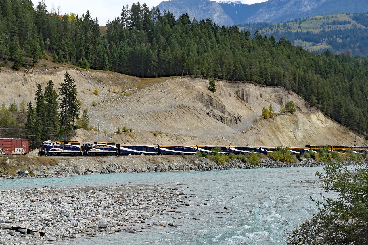 The Rocky Mountaineer  cruises alongside the kicking Horse River at Golden.