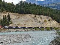 The Rocky Mountaineer  cruises alongside the kicking Horse River at Golden.