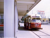 TTC PCC 4467 takes on a load of passengers on a sunny afternoon at Dundas West Subway Station, before departing bound for the annual Canadian National Exhibition held at the end of each summer. Special shuttle buses and streetcars were run by the TTC to shuttle crowds to and from the CNE from various points in the city. The routing of this run was likely Dundas West station, down Dundas St., down Dufferin St. and ending at Dufferin Loop, located by the CN Oakville Sub just outside the west entrance of the CNE.
<br><br>
In the background, the yellow building was occupied by Hertz rent-a-car, and behind that on the other side of Dundas Street was the large Canada Bread factory (Toastmaster sign on the roof).
<br><br>
<i>Lewis Swanson photo, Dan Dell'Unto collection.</i>