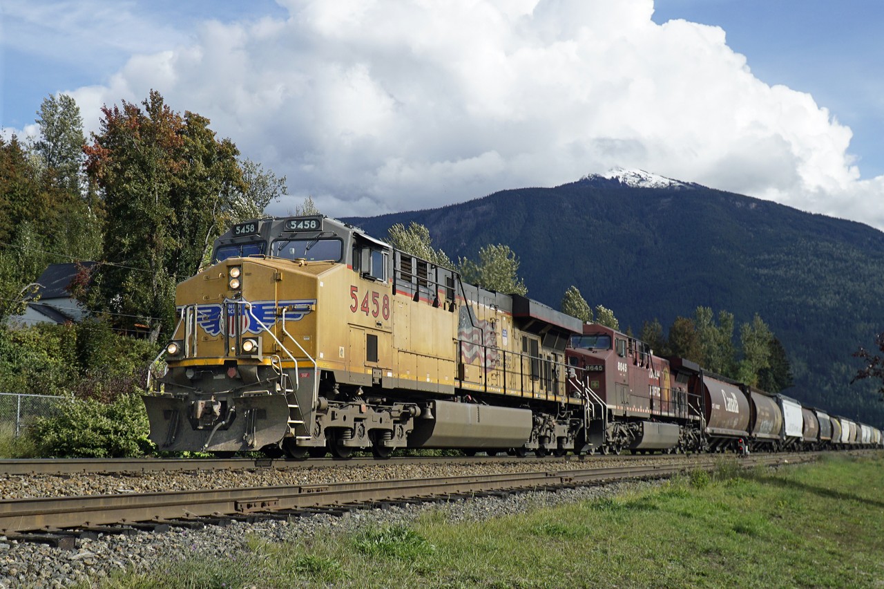 AC45CCTE UP 5458 and AC4400CW CP 8645 depart Revelstoke with a westbound grain train.