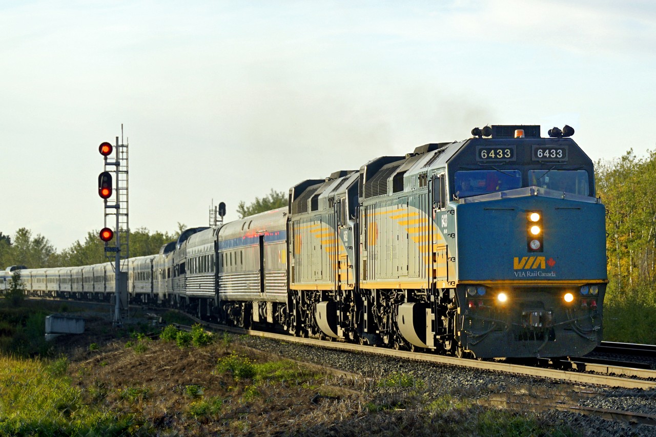 After heavy cloud all day and rain most of the afternoon the sun suddenly broke through just before setting.  So took the opportunity to go see VIA #2 running maybe only about half hour late.  As the days grow shorter there won't be many more shots like this 'till next spring.  Oh dear, must mean winter is coming.