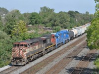 BCOL 4619 (Dash 8-40CMu Draper-taper cowl) and CN 2557 (Dash 9-44CW) power CN train 435, seen here during a head-end set off at the west end of Aldershot Yard. <br><br>
The blue GP38-2 units GMTX 2277 and 2325 are not running and will continue further west. Independent brake hoses are connected between all engines. The GMTX's are MU cabled together, but not to the lead locomotive pair.