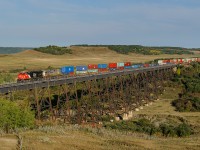 Brand new CN ES44AC 3822 and CREX ES44AC 1506 lead CN train Q108 over the Uno, MB trestle in the beautiful Assiniboine Valley.