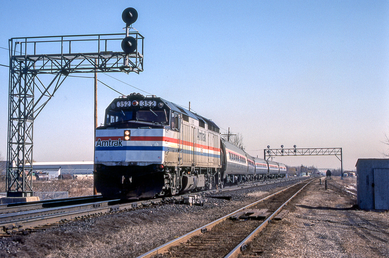 Amtrak 352 is heading through Burlington, Ontario on March 26, 1984.