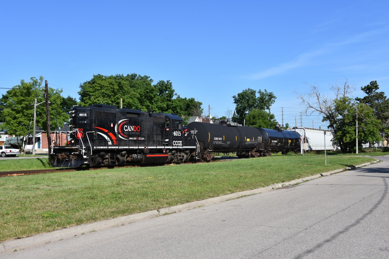 Having just crossed Park st seconds ago and now running parallel down Park st, CCGX 4015 makes its way south through downtown Brampton on a beautiful summer morning in late June. Trailing 4015 were a total of 8 freight cars and this was the OBRYs last run to Streetsville and back under CANDO as CANDO marked June 30th to be the day they leave Orangeville for good and a new operator ‘Trillium’ has since taken over operations on this 36 mile short line railway.  Time: 08:56