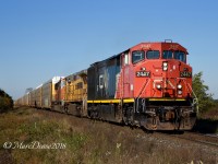 A very clean CN 2447 with GECX 9557 and PRLX 236 lead train 394 east out of Sarnia at Fairweather Sideroad.