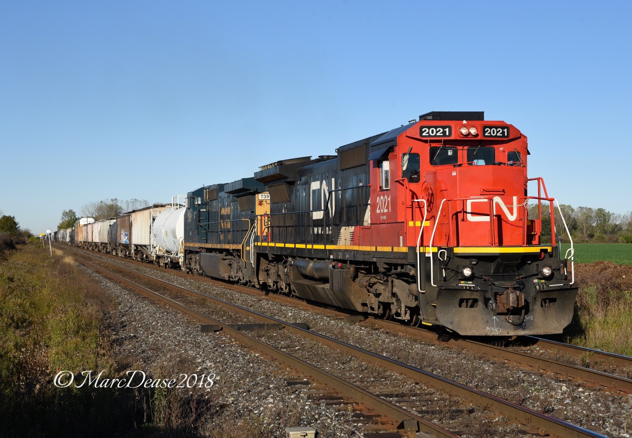 X384 passes Telfer Sideroad departing Sarnia with CN 2120 and GECX 7395.