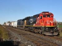 X384 passes Telfer Sideroad departing Sarnia with CN 2120 and GECX 7395.