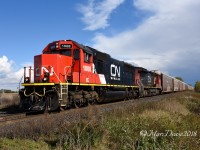 With threatening skies behind them train 397 crosses aptly named Fairweather Sideroad with IC 1008 in the lead. 