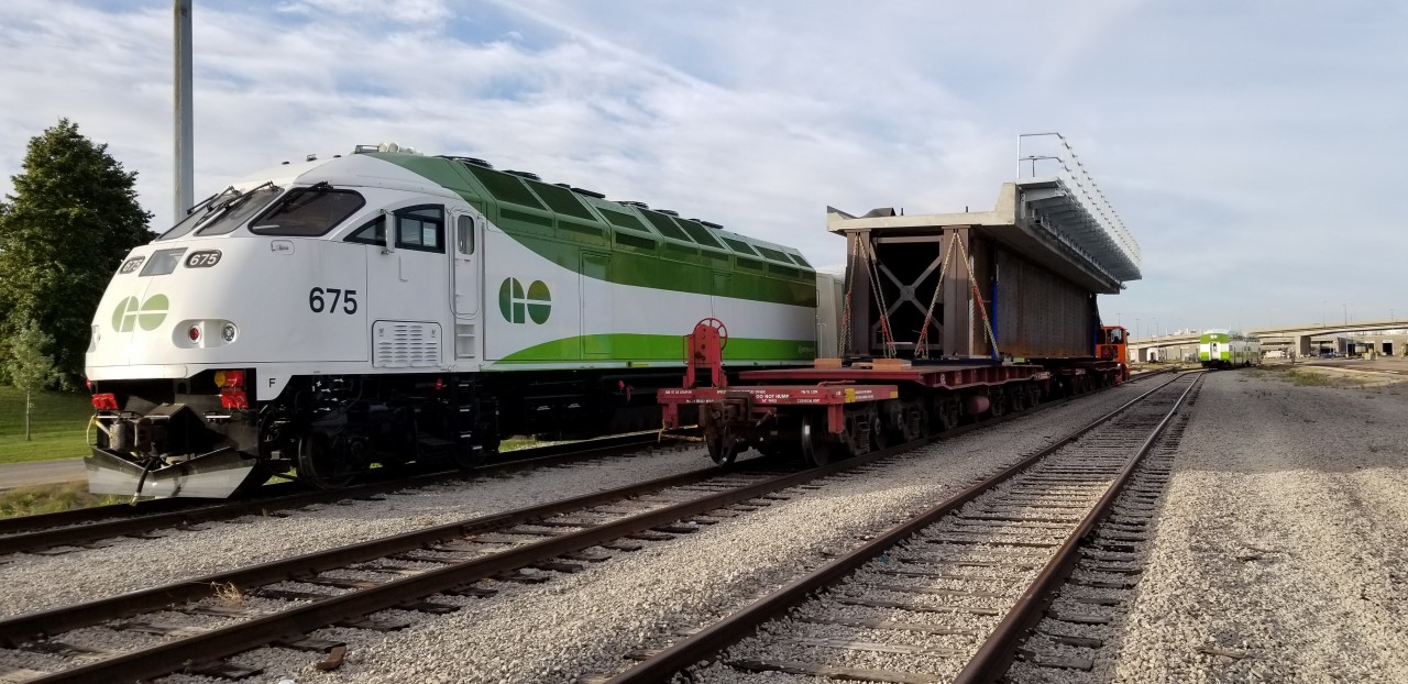 The new span moves past brand new Metrolinx MP54AC 765 at the VIA TMC . Replacing the span that was built in 1911, the new structure will undoubtedly last well past 100 years of railway service!