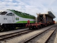 The new span moves past brand new Metrolinx MP54AC 765 at the VIA TMC . Replacing the span that was built in 1911, the new structure will undoubtedly last well past 100 years of railway service! 