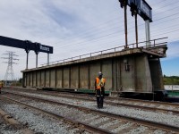 Well I promised you a unique perspective on the Metrolinx Humber River bridge replacement project as it takes shape over what was supposed to be 9 consecutive weekends. The project is ahead of schedule, so trains will run on the west Lakeshore Line this turkey day long weekend.
Hope you enjoy.

After months or preperation, the first span (there are two per track) off #1 track is lifted out of the river and will be moved into position of a waiting empty flatcar where it will be taken to the back of the VIA TMC and cut up for scrap.
