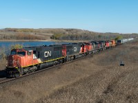 CN 5639 leads a large consist including EJE 672 on train 317 into Biggar on a perfect October day. 