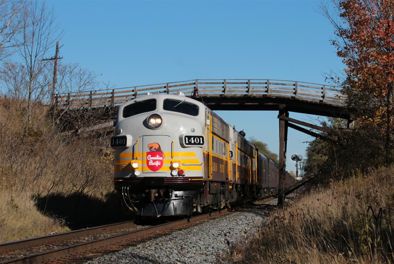 CP business train with the CEO riding comfy without a train in the world to meet. Ducks under the falling apart Stacy Rd bridge in Port Hope which comparing to Nichols rd less than a mile west which last year was torn down.