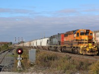 The cold autumn wind is blowing hard, while in the distance the orange autumn colours are gradually being stripped off the trees, this though is not the only fading orange shades, as Goderich-Exeter road train rolls east past the GO Station at Mount Pleasant, with little over a month left, GW orange will be all but a memory here soon too. This is one location I haven't spent much time at over the years, but it offers a bit of a change of scenery as the train leaves the Halton Hills behind and enters the urban sprawl of Brampton. the signal beside me for now basically serves no purpose with a temporary stopper installed on the tracks, but in the future the third track will eventually reach all the way to Georgetown.
