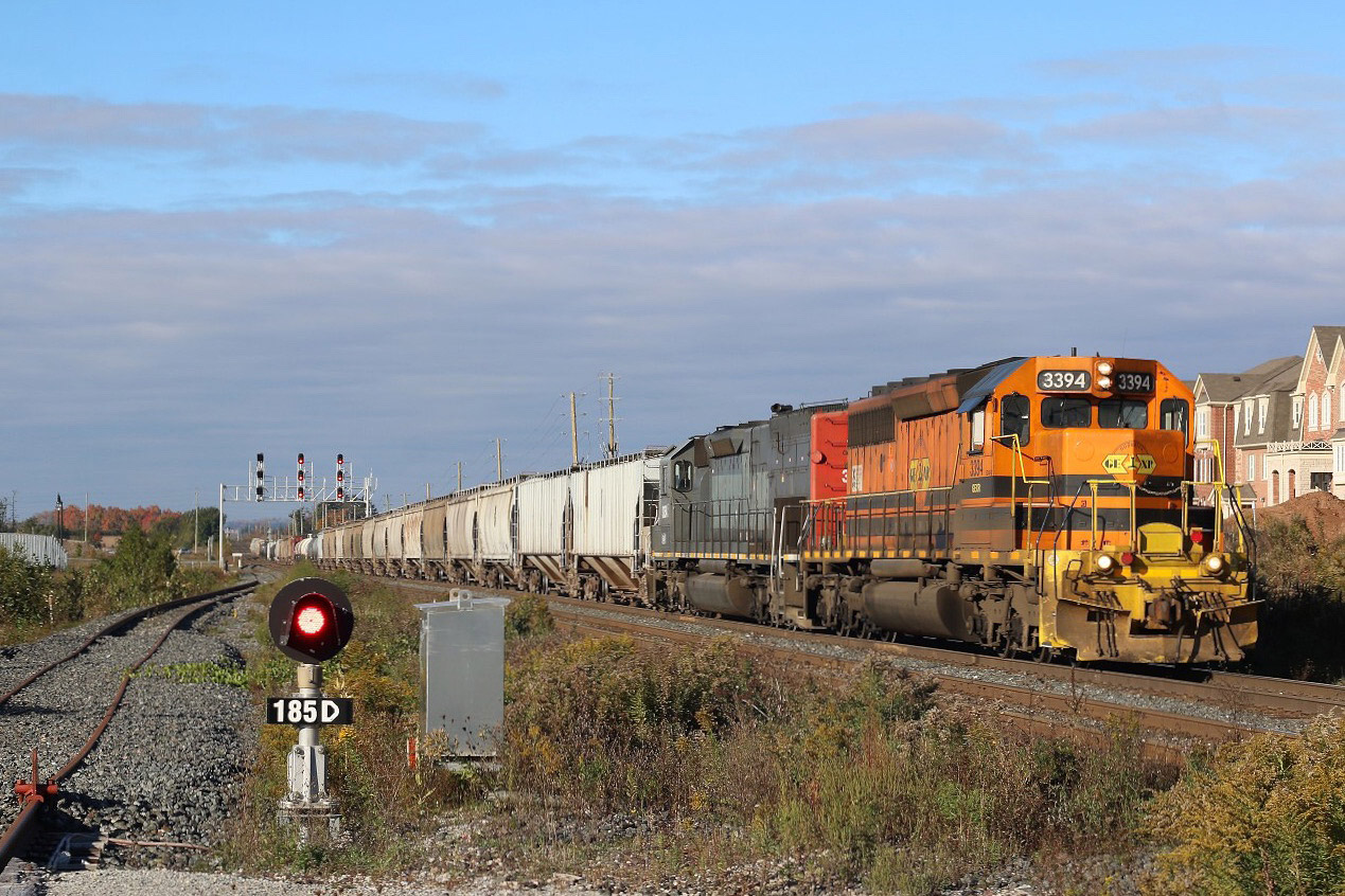 The cold autumn wind is blowing hard, while in the distance the orange autumn colours are gradually being stripped off the trees, this though is not the only fading orange shades, as Goderich-Exeter road train rolls east past the GO Station at Mount Pleasant, with little over a month left, GW orange will be all but a memory here soon too. This is one location I haven't spent much time at over the years, but it offers a bit of a change of scenery as the train leaves the Halton Hills behind and enters the urban sprawl of Brampton. the signal beside me for now basically serves no purpose with a temporary stopper installed on the tracks, but in the future the third track will eventually reach all the way to Georgetown.