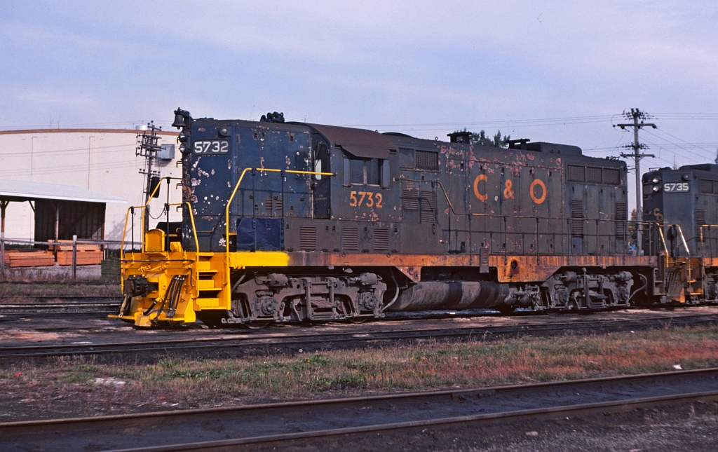 A rather tattered looking C&O 5732 at the roundhouse area in St. Thomas.  Perhaps Mr. Mercer might have an explanation of the fresh yellow paint on the short hood.   I was "home" in Ontario for a family visit and spent sometime with my Grandmother in St.Thomas. Did a short time railfanning while there and got a few images of the C&O. My Grandfather was an Engineer for the Wabash in St Thomas and the street he lived on there were railroader neighbors that worked for the CN, Wabash, NYC and the PM (C&O). Oh what a joy that would be to chat with those folks now.  St Thomas was a great railroad town for many years, sadly the railroads are all gone now.