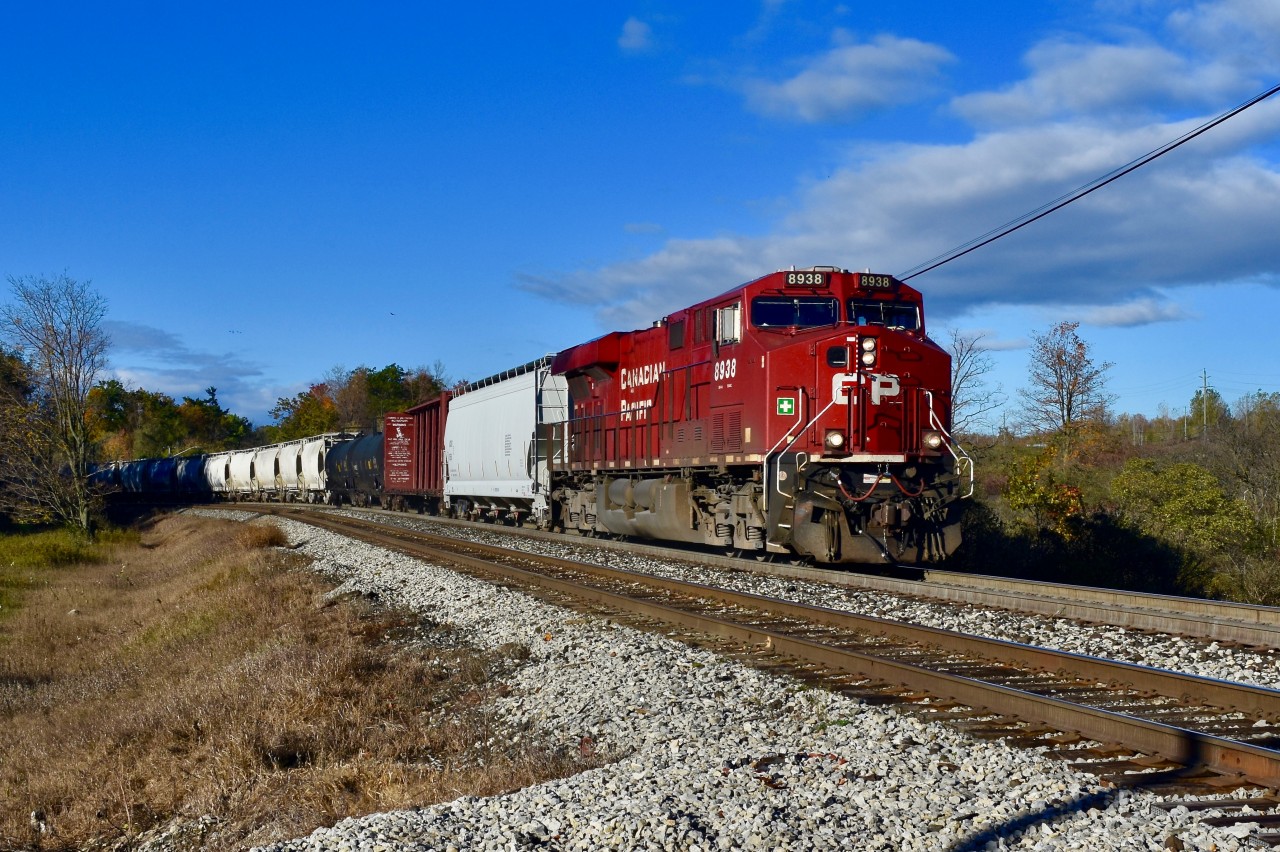 Rounding the bend just outside of Campbellville, CP es44ac 8939 zippers by with a short eastbound freight trailing. They are approaching Canyon road just south of the 401 and it is exactly 09:37 on a cold but sunny fall morning.
