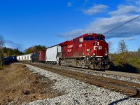 Rounding the bend just outside of Campbellville, CP es44ac 8939 zippers by with a short eastbound freight trailing. They are approaching Canyon road just south of the 401 and it is exactly 09:37 on a cold but sunny fall morning. 