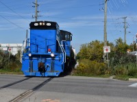 GMTX 333 leads half a dozen freight cars southbound through downtown Brampton on its way to Streetsville to interchange with CP. They are crossing over Railroad st and the Halton in this scene and this way the odd morning when the train came at a good time where they would not get stuck behind one of the half-hourly scheduled GO Trains on the Halton. 
Time: 11:12