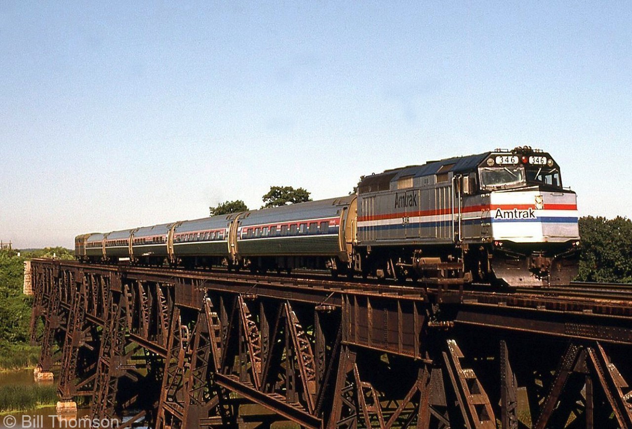 Amtrak F40PH 346 leads the daily VIA-Amtrak Maple Leaf's consist of five Amfleet cars and a baggage, heading southbound across the bridge at Jordan Station on the CN Grimsby Sub.