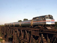 Amtrak F40PH 346 leads the daily VIA-Amtrak Maple Leaf's consist of five Amfleet cars and a baggage, heading southbound across the bridge at Jordan Station on the CN Grimsby Sub.