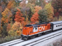 At the height of fall colours in October 1975, CN train 141 coasts under the Plains Road bridge and into Bayview. Once through the 15 mph switches, the engineer will crack the throttle and charge up the Dundas hill en route to London and Windsor.