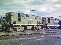 Before I purchased my first SLR film camera, I had a fixed lens 35mm camera that was very unreliable.  The shutter would jam or stick open.  Once in a while, I got a good picture considering the quality of the hardware it was taken with.  Here, MLW RS-18 3840 with CN 4507 are are Stuart St. along with CN 1322 and an MLW S-2 switcher.  The diesel shop that RailLink used for many years is still under construction.  