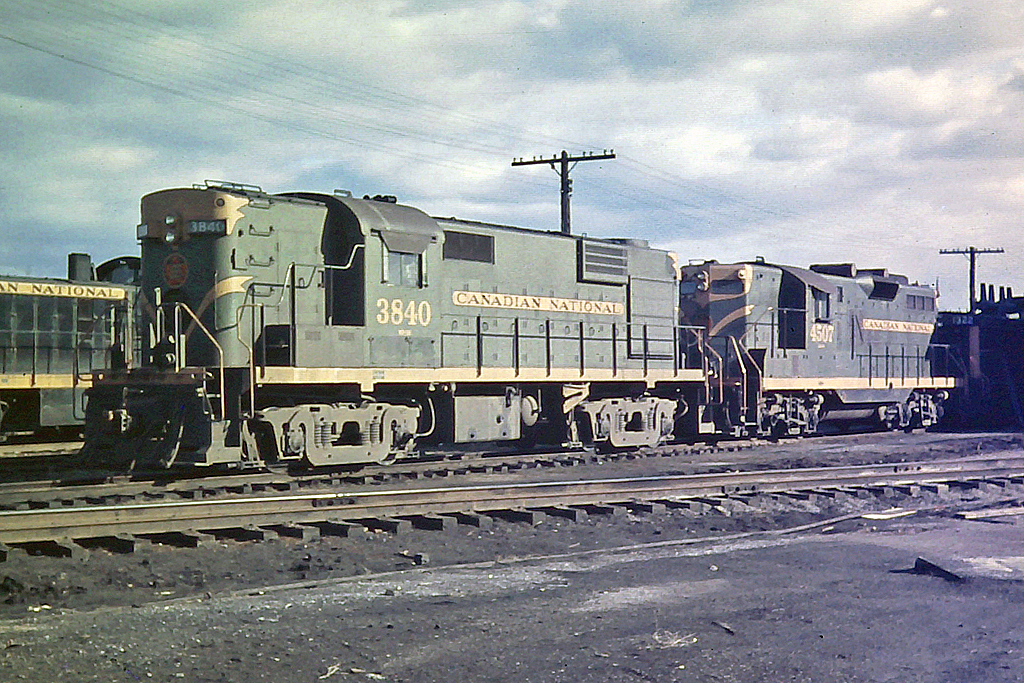 Before I purchased my first SLR film camera, I had a fixed lens 35mm camera that was very unreliable.  The shutter would jam or stick open.  Once in a while, I got a good picture considering the quality of the hardware it was taken with.  Here, MLW RS-18 3840 with CN 4507 are are Stuart St. along with CN 1322 and an MLW S-2 switcher.  The diesel shop that RailLink used for many years is still under construction.