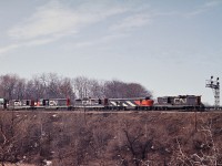 In the consist, CN 4518-6703-4485-5036-4596 at Bayview Jct. taken from the Spring Garden Road.  This location is mostly obscured by vegetation now making it difficult to replicate this shot.  Note that CLC CPA16-5 has been relegated to freight service.  The end of the C-Liners is drawing near.  