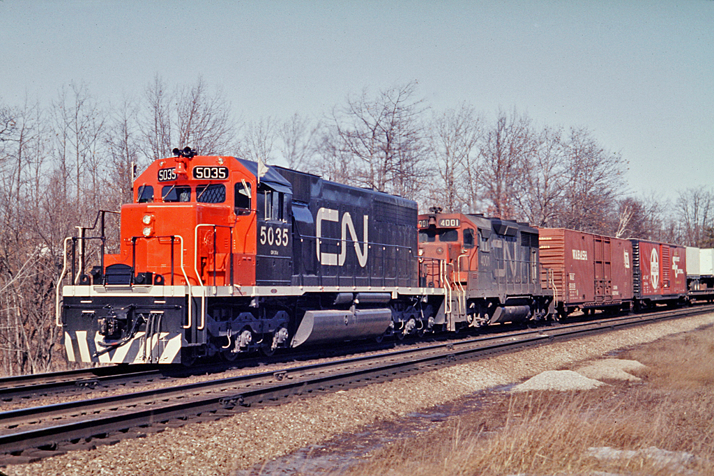 CN 5035 is still relatively clean albeit a recent addition to CN's roster.  The trailing unit, 4001 is one of two CN GP35's built in 1964 to grace CN rails.