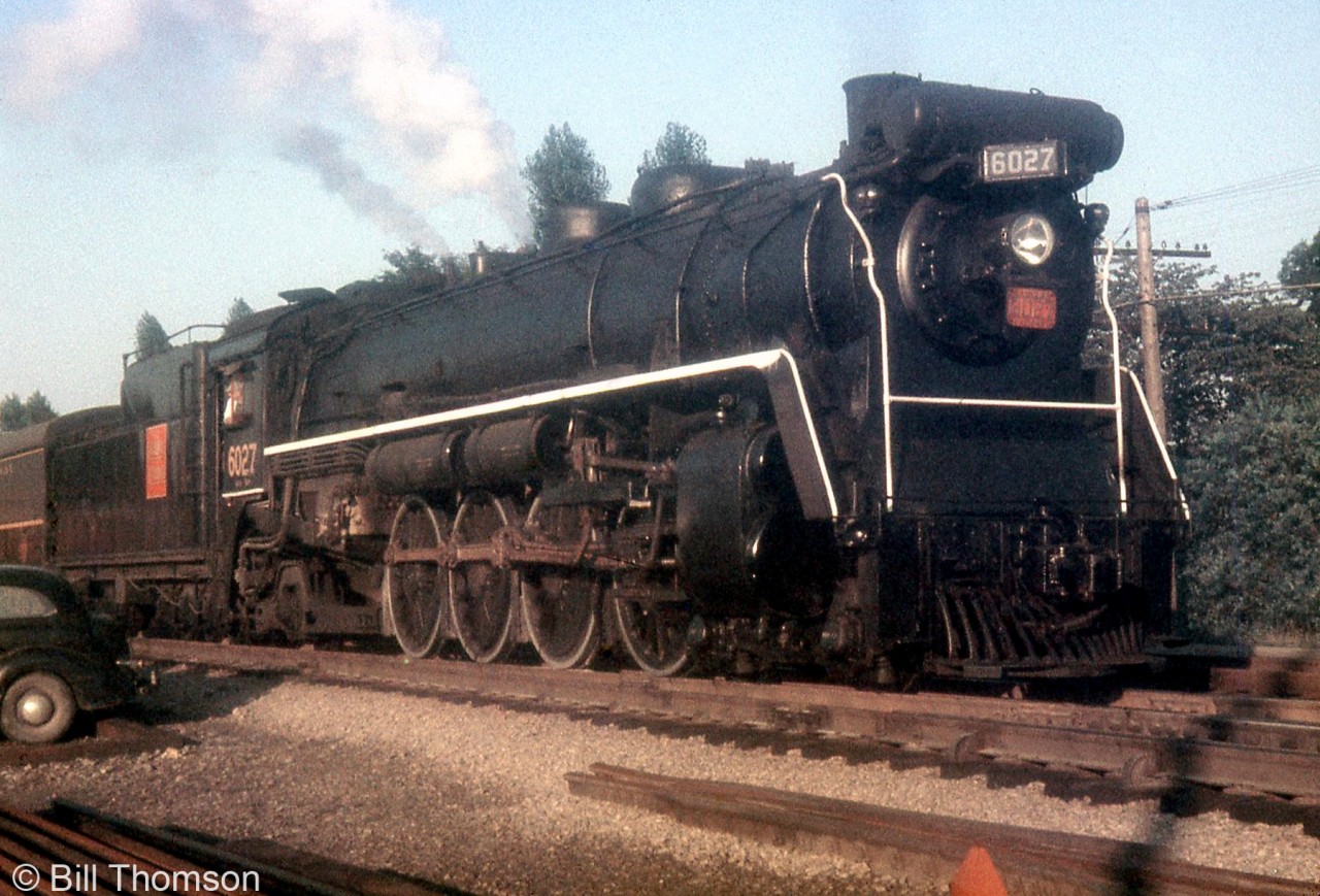 CNR Mountain 6027 (a U1b class unit built by CLC in 1924) handles a morning commuter train, at Port Credit in 1956.