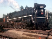 CNR Mountain 6027 (a U1b class unit built by CLC in 1924) handles a morning commuter train, at Port Credit in 1956.