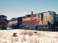 CP GP9, not overly common in Southern Ontario, is at the TH&B Chatham St. roundhouse.  Generally speaking, GM power was assigned out west while the MLW power was kept in the east.  This is probably the power for the Goodrich train.  