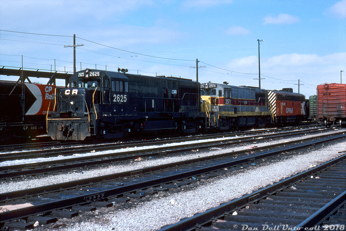 Whose railway is this anyway? Power for the CP/TH&B "Starlight" (Toronto-Hamilton) sits inside CP's Toronto Yard awaiting the call to duty. One could often find CP, TH&B, NYC/PC/CR or a mix of power on this train, but today's 70's mega-mix lashup features Conrail U25B 2625 in patched Penn Central black, U25B 2571 still sporting Erie Lackawanna paint from its former bankrupt owner who was squeezed into Conrail the previous year, and CP F7B 4438 tacked on for good measure (looking back, one could often note the "token B-unit" tacked onto many different CP lashups of that era, including behind modern 6-axle units. Extra power was extra power I suppose).  These same two CR U-boats were noted in a photo taken a few weeks earlier at Stoney Creek trailing a TH&B Geep, so I would hazard a guess they found their way north on the "Kinnear" from Buffalo and stayed around for a bit. Maybe one of the usual suspects can chime in on how long PC/CR power stuck around on the TH&B/CP for.  Bill McArthur photo, Dan Dell'Unto collection.