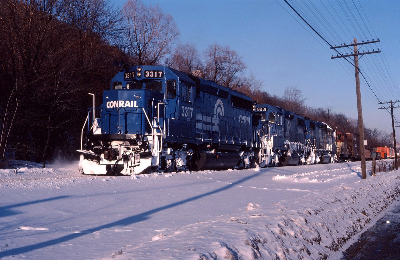 Running late on a cold February day, CPBU makes its appearance at Kinnear Yard. Today's power is Conrail GP40-2 3317, GP38-2 8231, another CR GP38-2 and a TH&B GP7. In a little over two months, Conrail power through Hamilton on a daily basis will be history when CP takes possession of the eastern end of the Canada Southern and integrates it into the TH&B as "CP Rail (CASO)".
