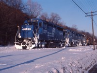 Running late on a cold February day, CPBU makes its appearance at Kinnear Yard. Today's power is Conrail GP40-2 3317, GP38-2 8231, another CR GP38-2 and a TH&B GP7. In a little over two months, Conrail power through Hamilton on a daily basis will be history when CP takes possession of the eastern end of the Canada Southern and integrates it into the TH&B as "CP Rail (CASO)".