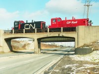 I'm not sure if in 1994 CP and CN shared duties switching the Ford Assembly Plant in Oakville, but it certainly looks that way. Anyone??   CP 1270 & CN 7302 as seen over Royal Windsor Dr.