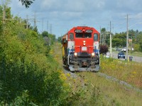 GEXR 580 returns from interchanging with GEXR 582 in North Guelph on what looks like garden railway tracks