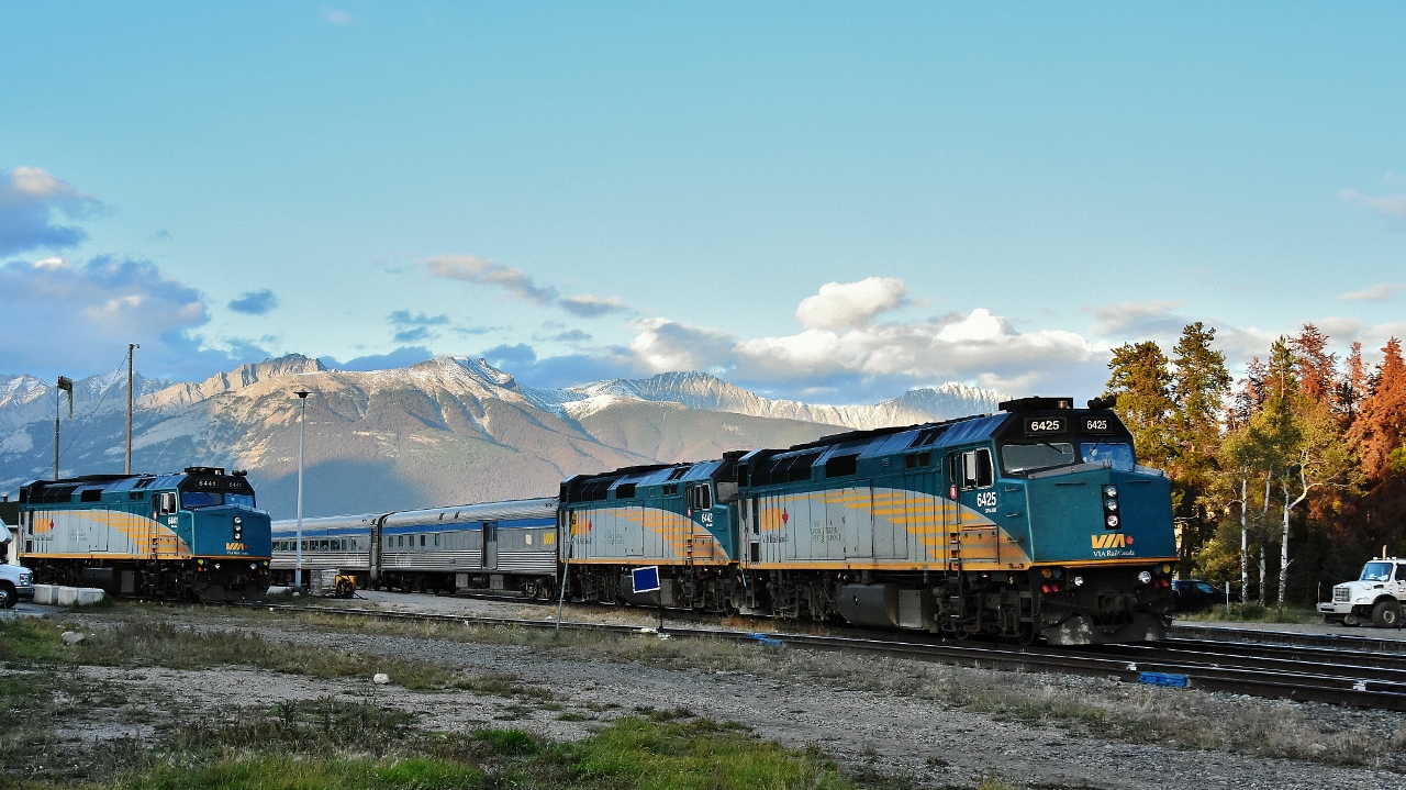 ....it's a beautiful evening...
 
 
...to be train watching in Jasper....
 
 
...and not a CN unit in sight...
 
 
VIA #1 is two hours late departing Jasper station,  
 
 
Tuesday September 18, 2018 at 20:30; image by S.Danko at Jasper Alberta
 
 
what's interesting
 
 
the quite noticeable haze remains, evidence of the  summer 2018 severe forest fire season – on this day  the fires continue to burn in northeast British Columbia
 
 
 Sept 18 at 20:00 VIA equipment (perhaps standby for Wednesday's VIA #5 ) at the VIA Jasper service cabin back track from east (end of track) to west:
 
8133 at end of track, coach in same location as prior week
8613 Baggage
8123 coach
6441 F40PH-3 ( at idle - account the expected frosty night - facing west )
 

also seen at Jasper 9 am Tuesday September 18, 2018 on Jasper Station track:
 
( possible consist for train #5 departure 12:30 Wednesday )
6459 F40PH-3 ( shut down facing East)
8601 baggage
8126 coach
8511 Skyline
 
 
sdfourty