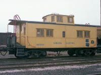 I rather doubt many 'cranks will be turned' looking at this, but I am posting an image of General Electric caboose GEX 80004 in hopes that someone can tell me something about it. How many did they have back then, where is this thing now?  And I guess I wonder if anyone else has photos of it.  The caboose was in Fort Erie, I guess as the security car along with a huge recessed flat that I marked as GEX 80003, but looking at the photo cannot see a number.
Anyone have any info? It would be appreciated.